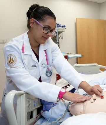 Nursing student performing an examination