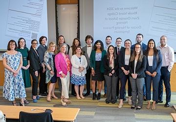 Doctor of Nursing Practice students in group photo at symposium event